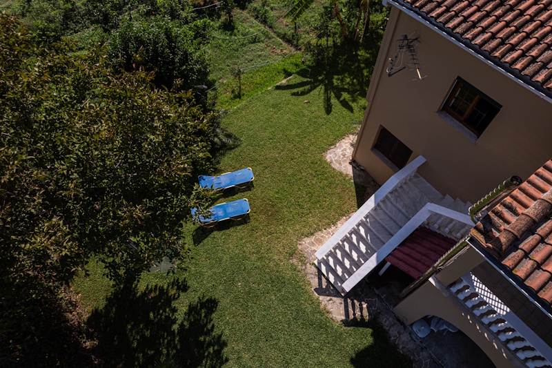 Garden area with sun loungers at Selini Villa in Kalithea