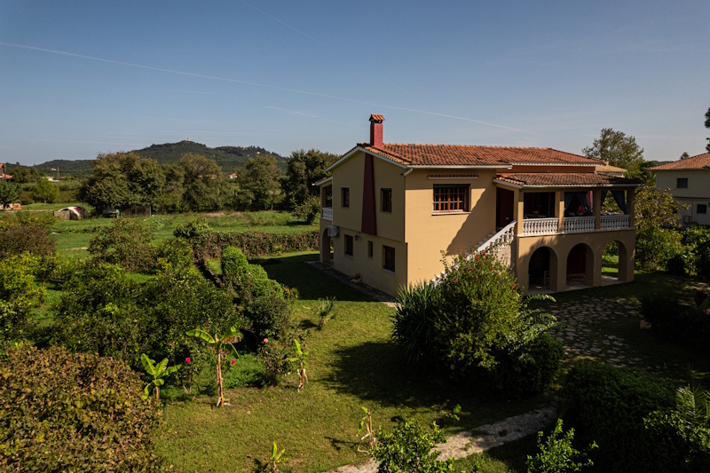 Exterior view of Selini Villa in Kalithea with garden and countryside surroundings