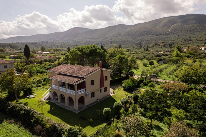 Aerial view of Selini Villa in Kalithea surrounded by greenery and mountains