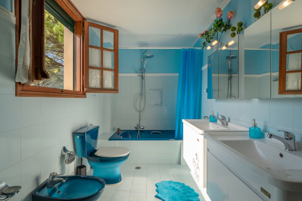 Bathroom with bathtub and shower at Selini Villa in Kalithea