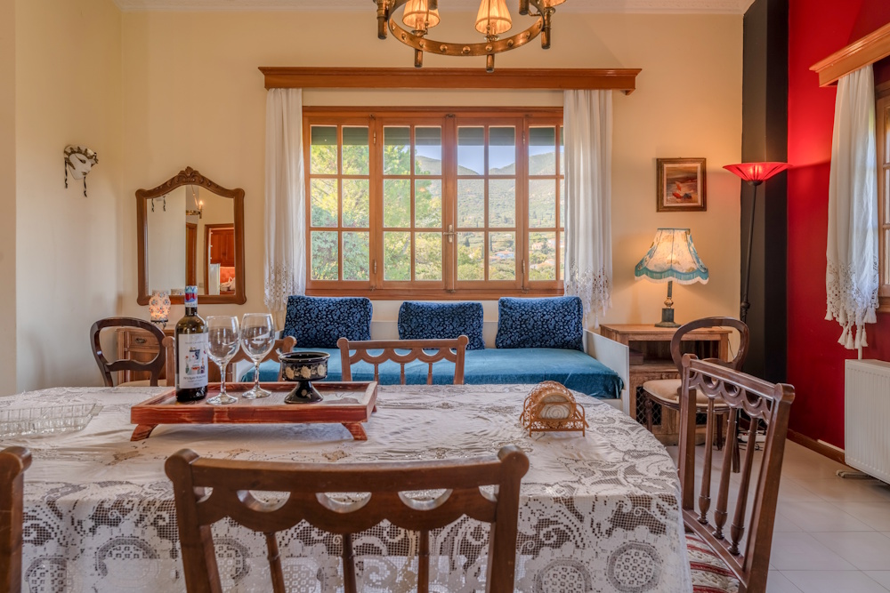 Dining and living area with traditional decor at Selini Villa in Kalithea
