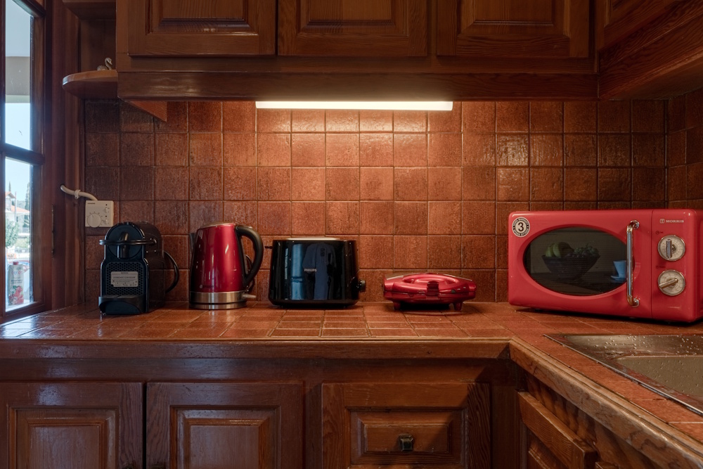 Kitchen countertop with appliances at Selini Villa in Kalithea