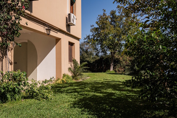 Garden area next to Selini Villa in Kalithea with greenery and lawn