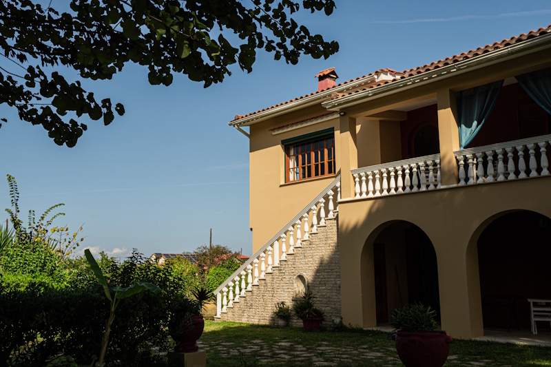 Exterior detail of Selini Villa in Kalithea with staircase and balcony