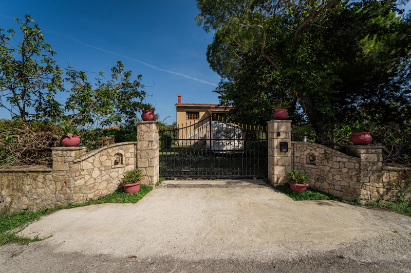 Stone entrance gate of Selini Villa in Kalithea
